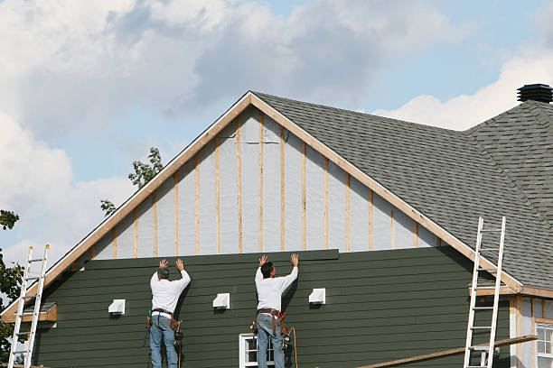 Professional Siding Installation technician working in East Rockaway, NY
